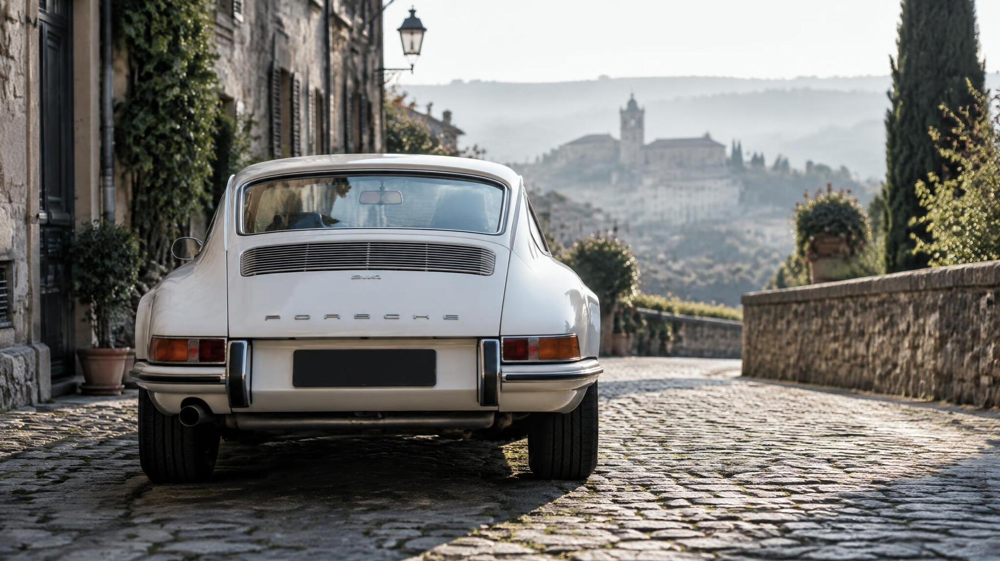 White sports car rear view in a quiet street