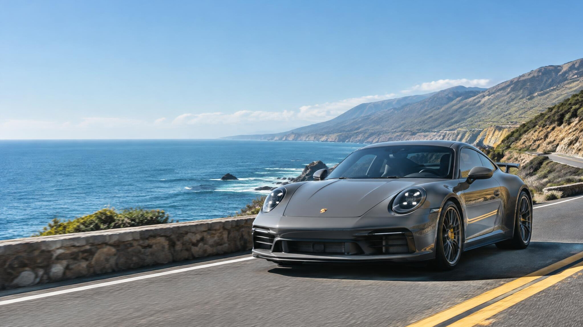 Grey sports car on a road in daylight