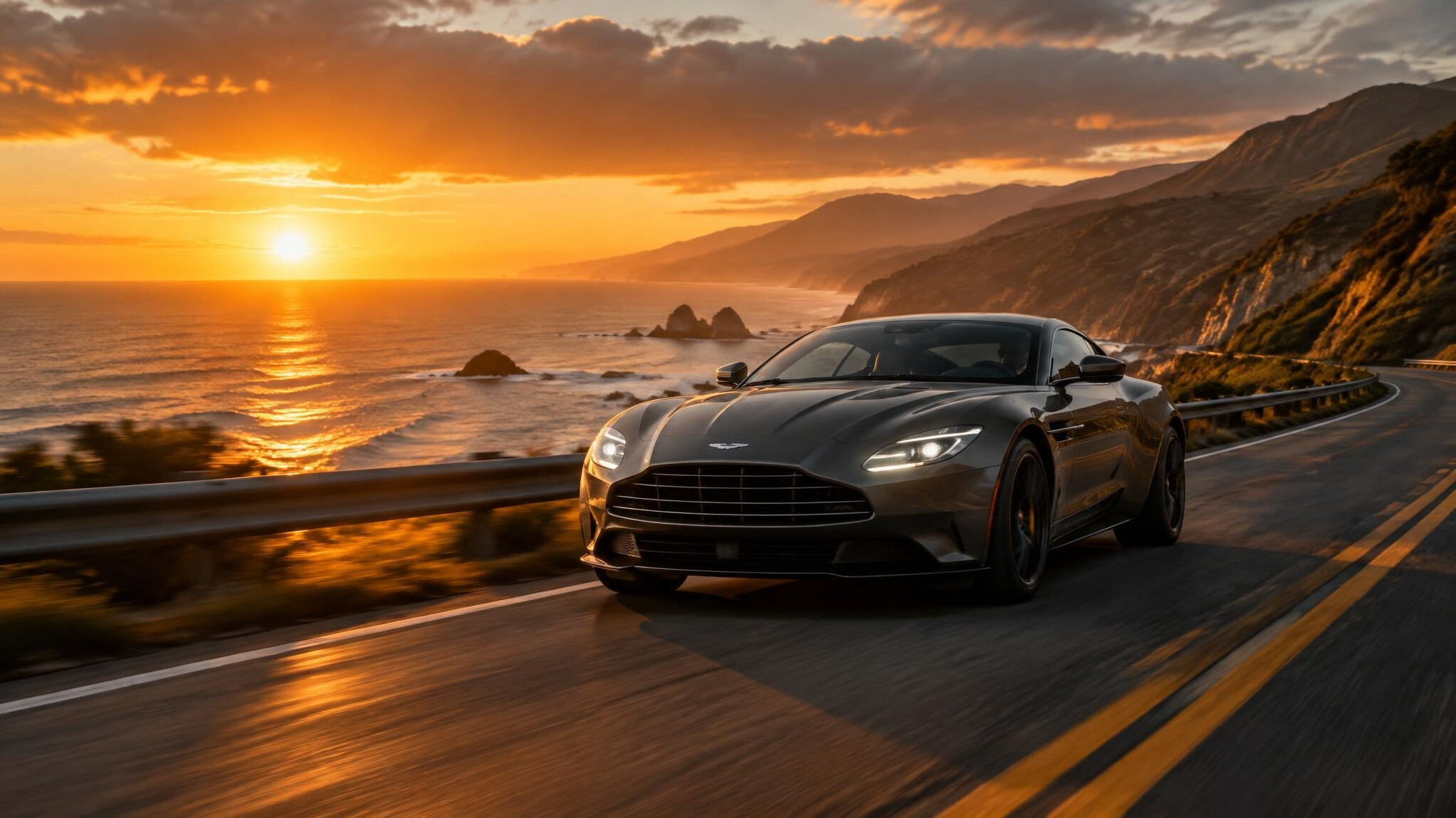 Luxury sports car driving along a coastal road at sunset